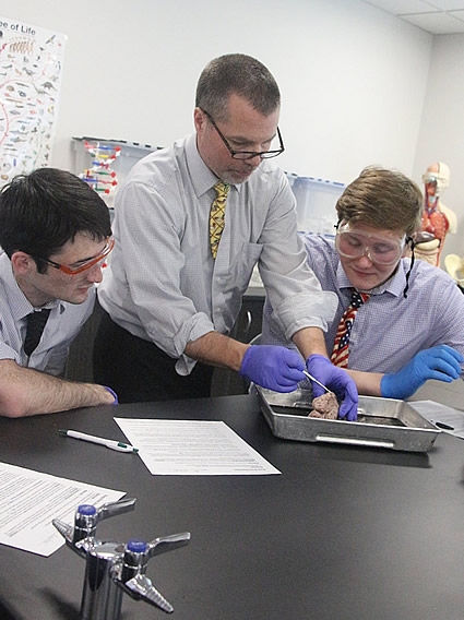 Students and teacher conducting a lab