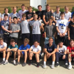 A group photo of the class of 2021 in front of the retreat center.