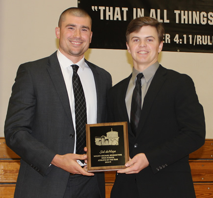 Photo of Coach Spooner presenting Athlete of the Year award to Sid deMayo