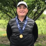 Luke Poses with his Championship Medal