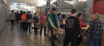 Photo of Students hauling books to New Building