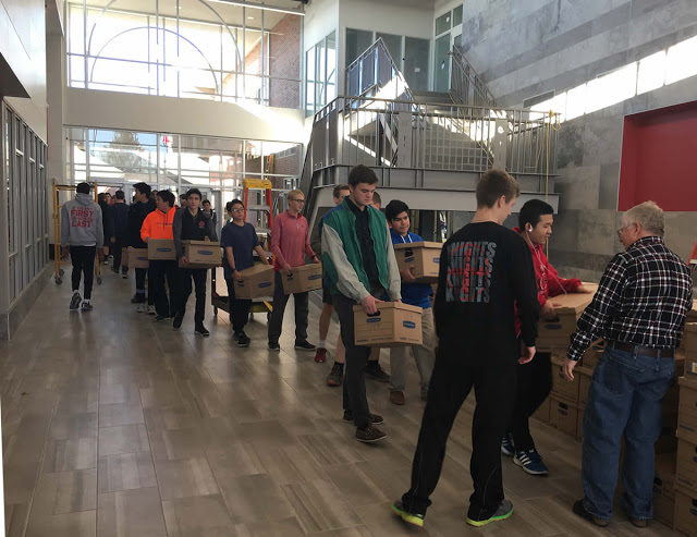 Photo of Students hauling books to New Building